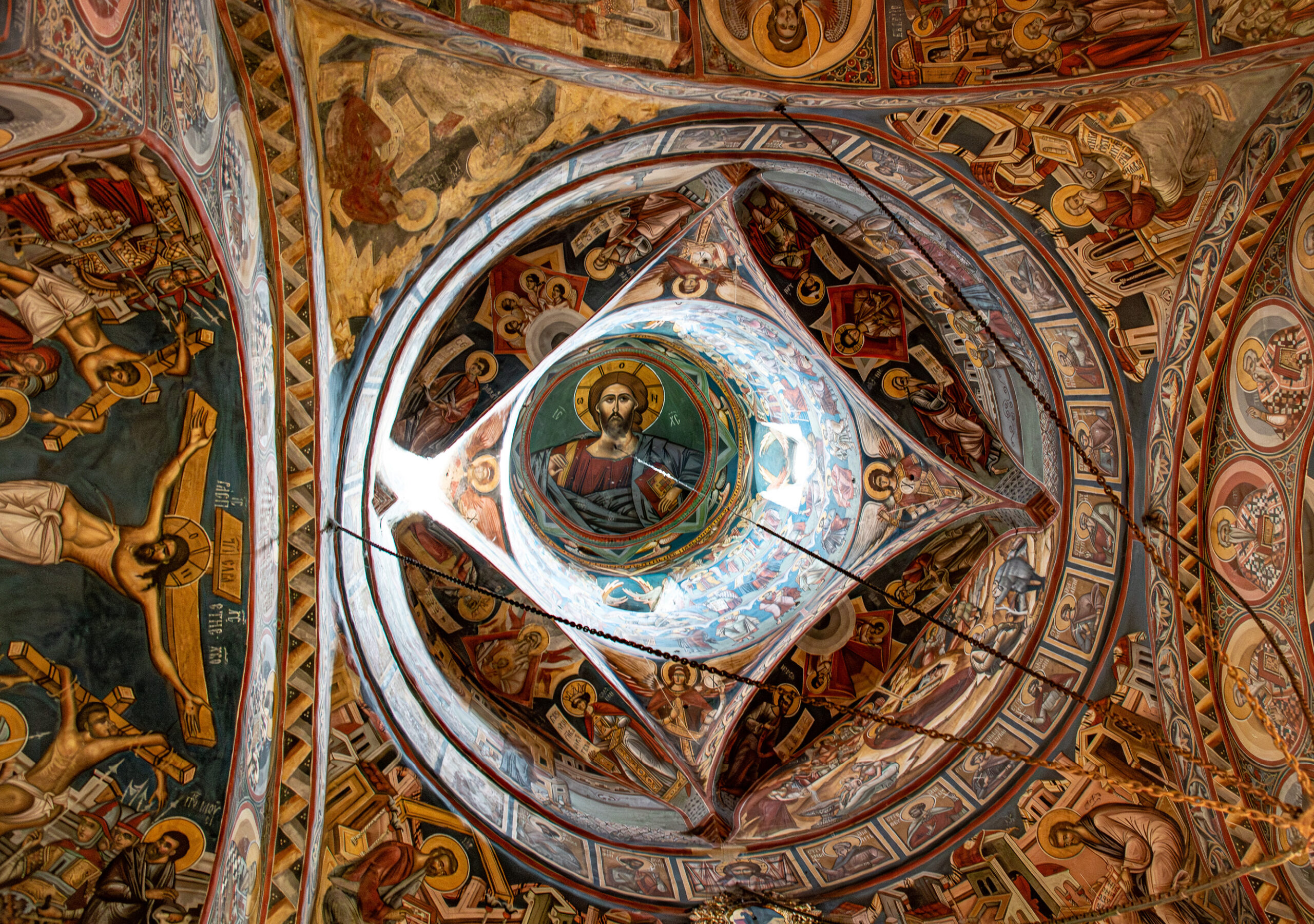 Ceilings as well are covered with murals. Jesus frowns from the recesses of the church’s cupola.