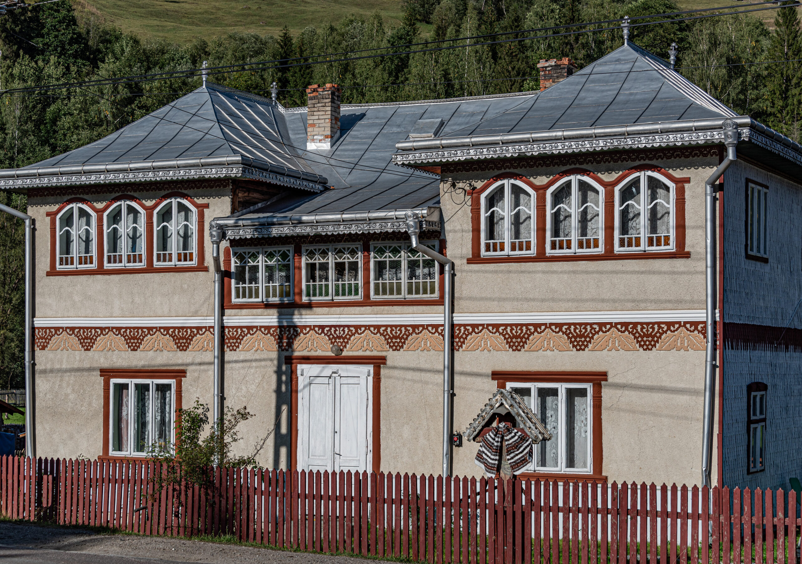 Doors and windows of houses exhibit a painted or applied trim in Bucovina