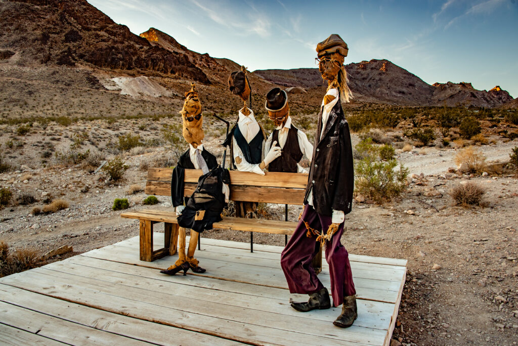 Quirky sculptures waiting for the train are among several Rhyolite art installations