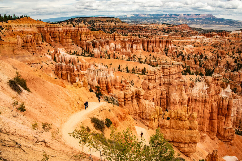 Hiking trails snake down into Bryce’s amphitheaters past hoodoos standing guard