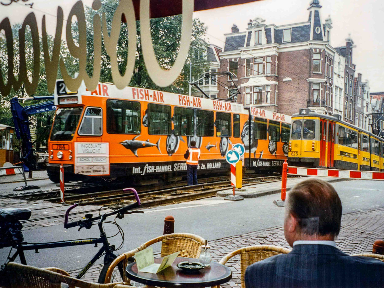 Relaxing in a corner coffee shop watching life on an Amsterdam street